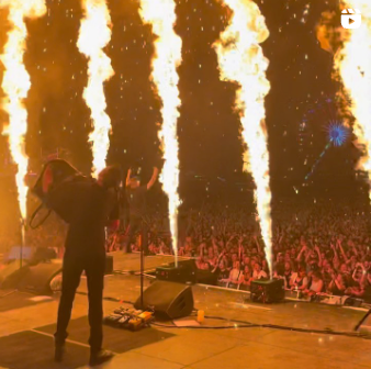 A video of Dropkick Murphys performing on stage with pyrotechnics.
