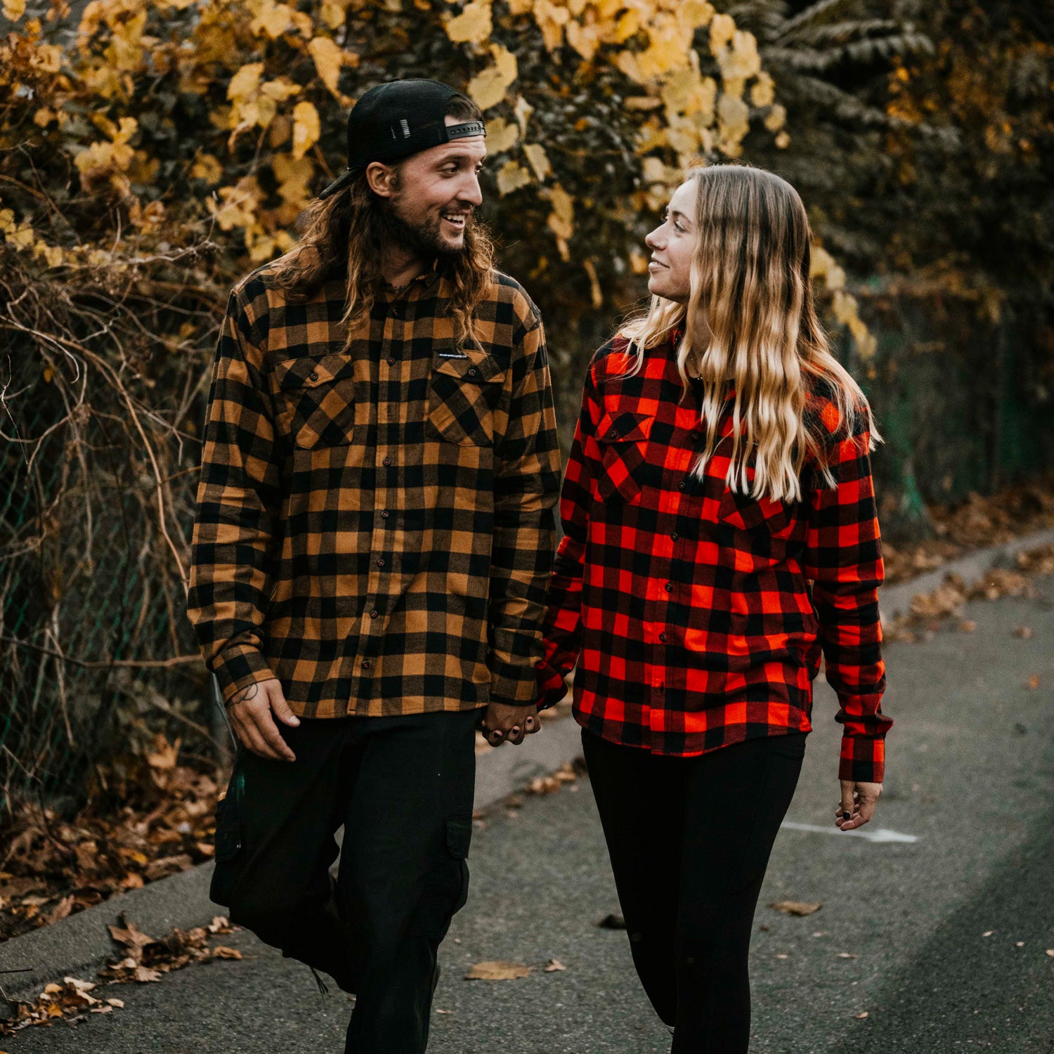 Couple holding hands in the Death Wish Coffee Medium Roast and Dark Roast Flannels.