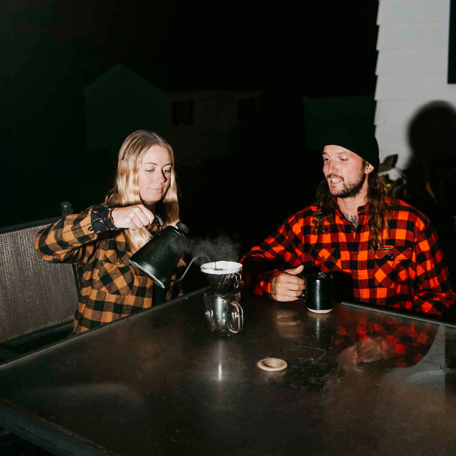 Brewing coffee outside in the Medium Roast and Dark Roast Flannels.