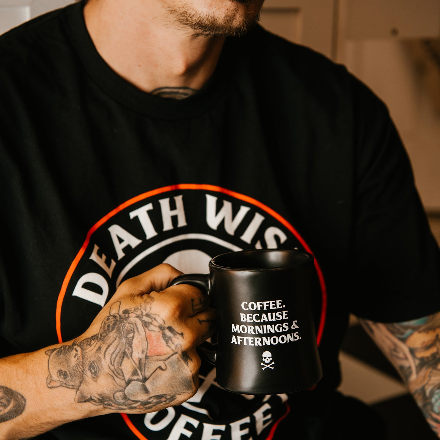Holding the Death Wish Coffee Morning and Afternoon Mug 