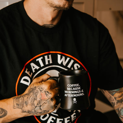 Holding the Death Wish Coffee Morning and Afternoon Mug