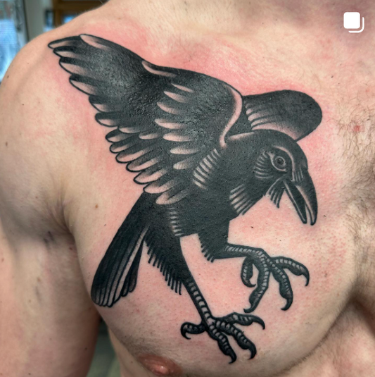 A picture of a raven tattoo done by Peter Clarke of Dead Presidents Lounge.