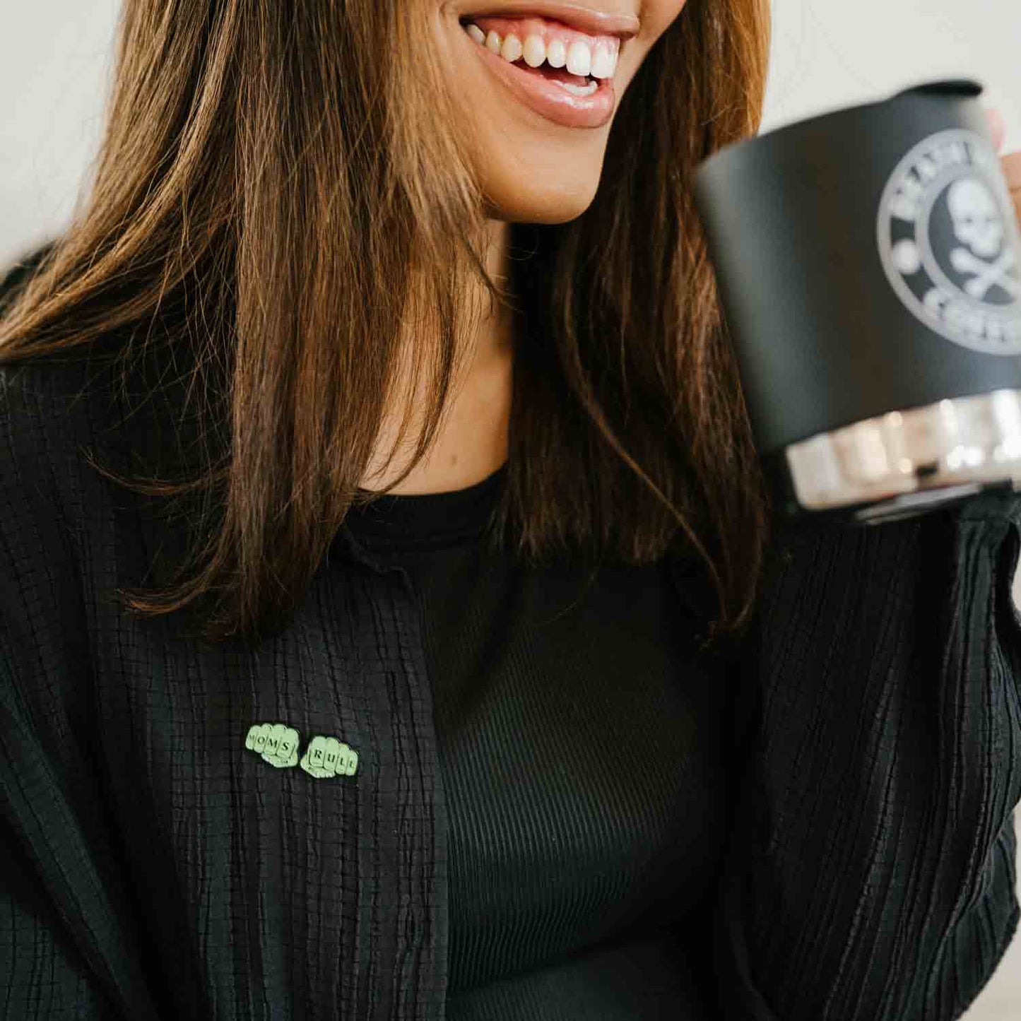 Drinking Death Wish Coffee and wearing the Moms Rule pin from the Rad Mom Kit.