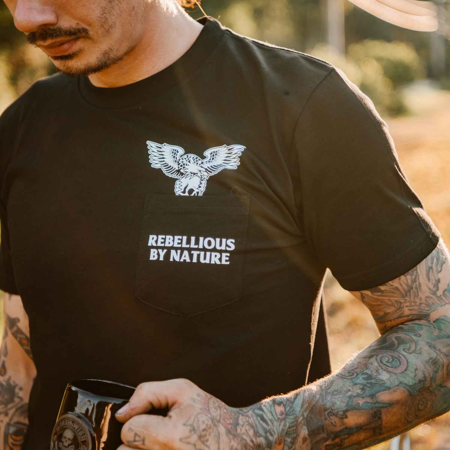 Drinking coffee in the Death Wish Coffee Rebellious by Nature Pocket Tee.