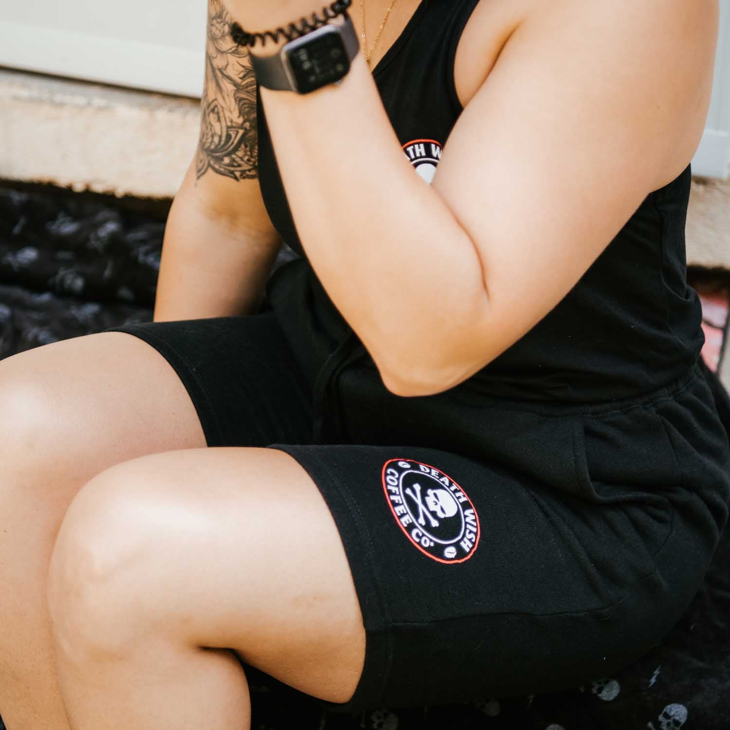 Resting post-workout in the Death Wish Coffee Lights Out Shorts.
