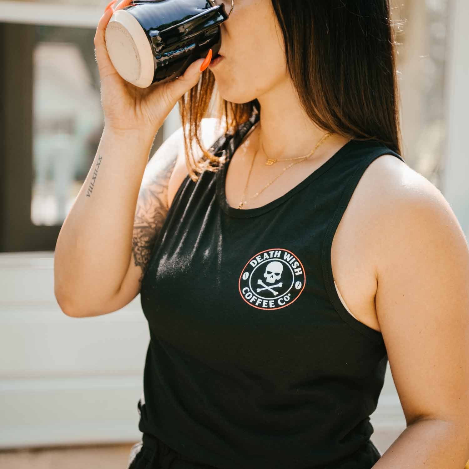 Drinking coffee in the Death Wish Coffee Lights Out Muscle Tee
