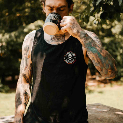 Drinking coffee in the Death Wish Coffee Lights Out Tank.